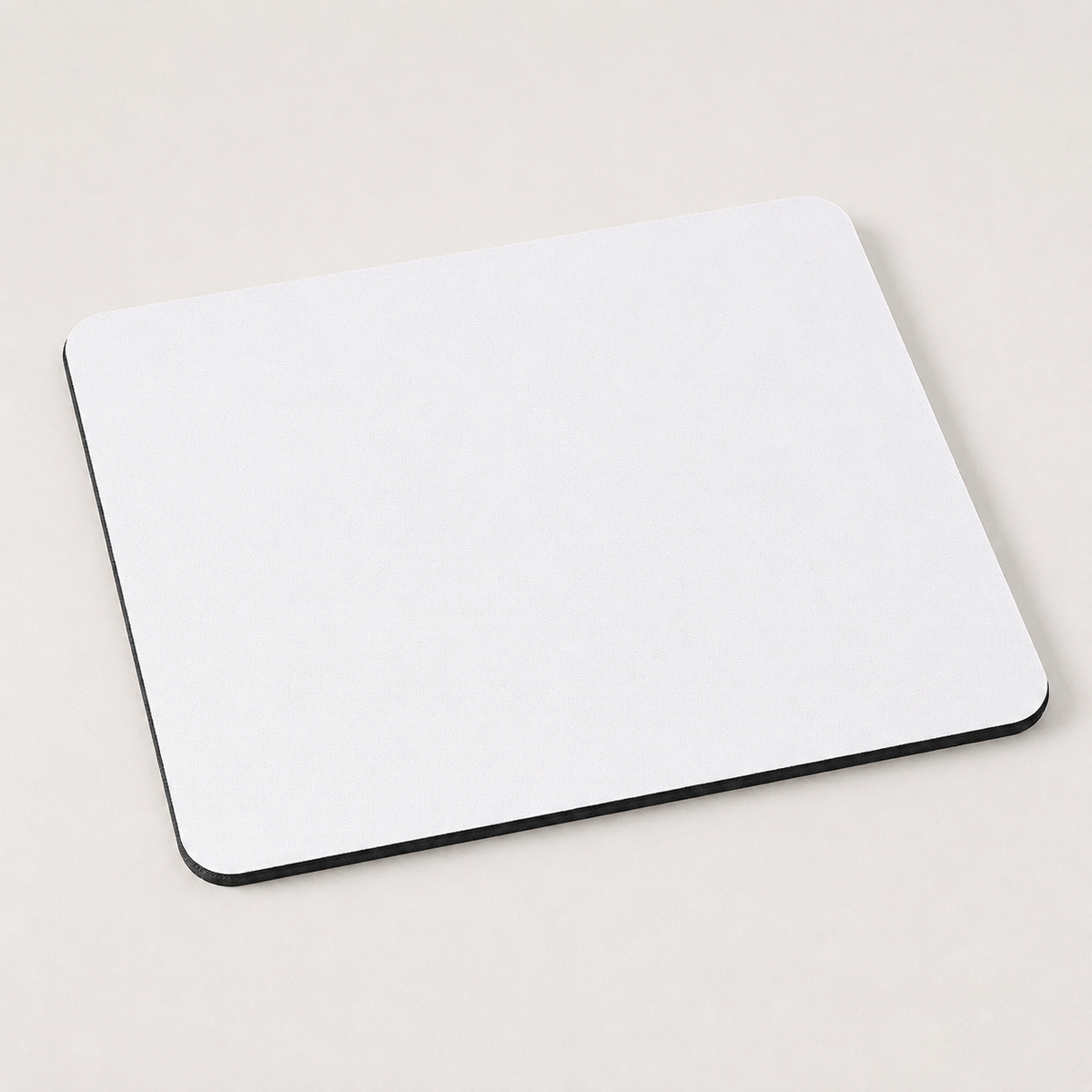Blank white 9.25 by 7.75 inch mouse pad with black neoprene edge